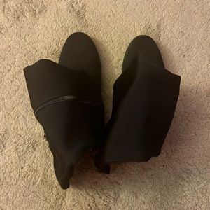 Torrid black elastic knee high boot; zippered. Size 8W.